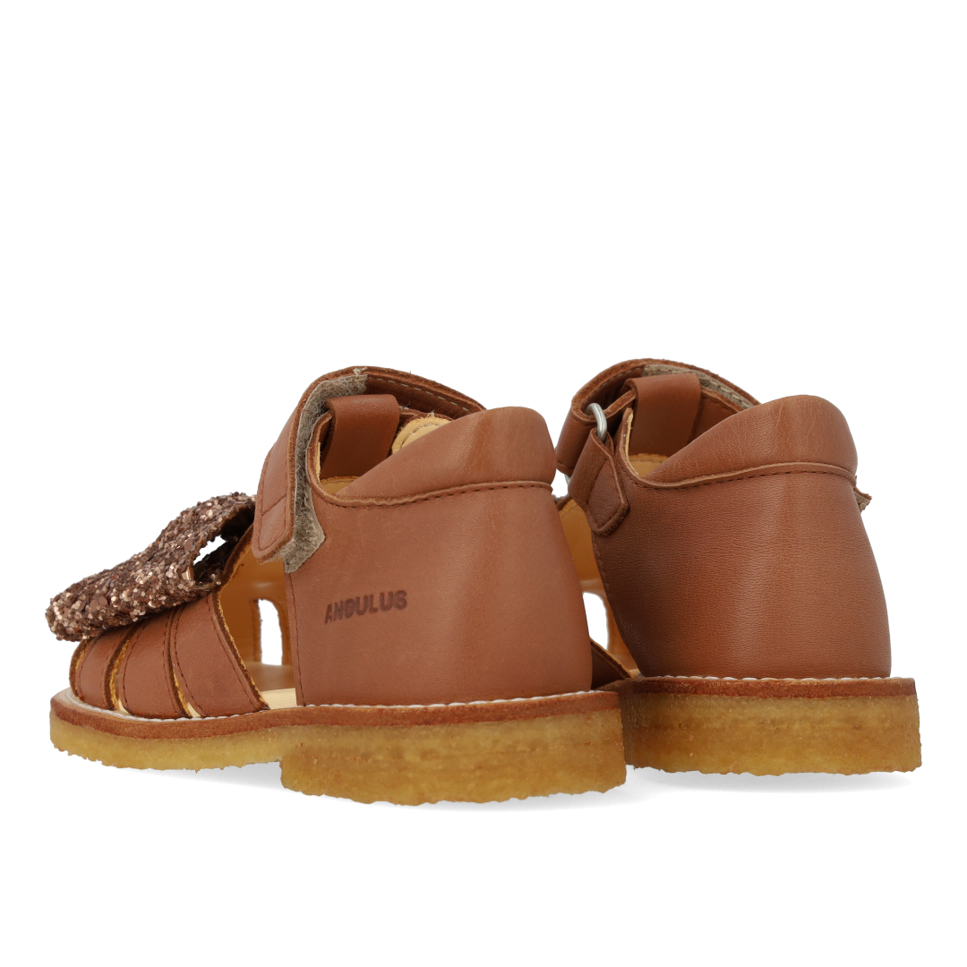 Toddler sandal with glitter bow and Velcro closure