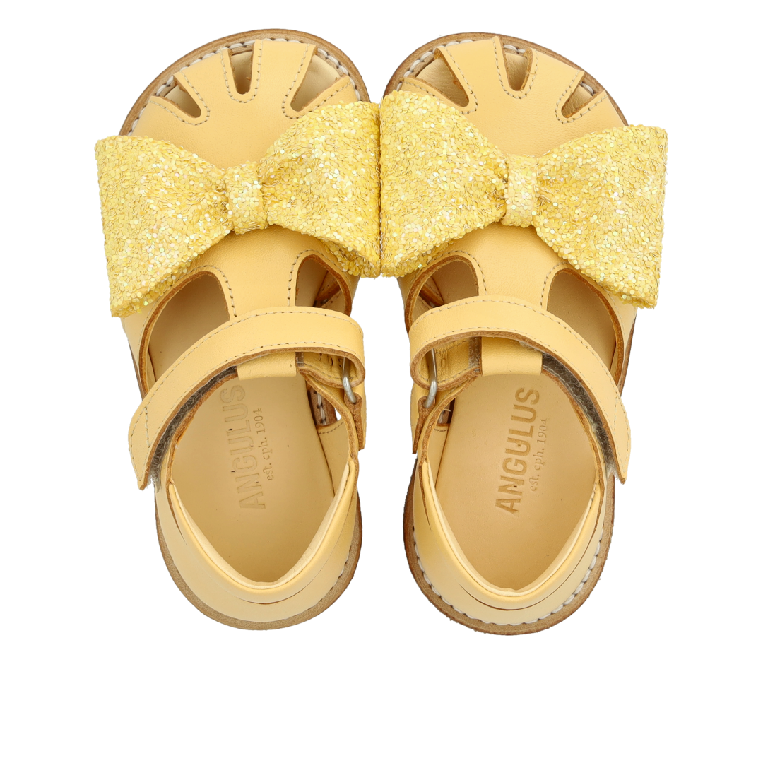 Toddler sandal with glitter bow and Velcro closure