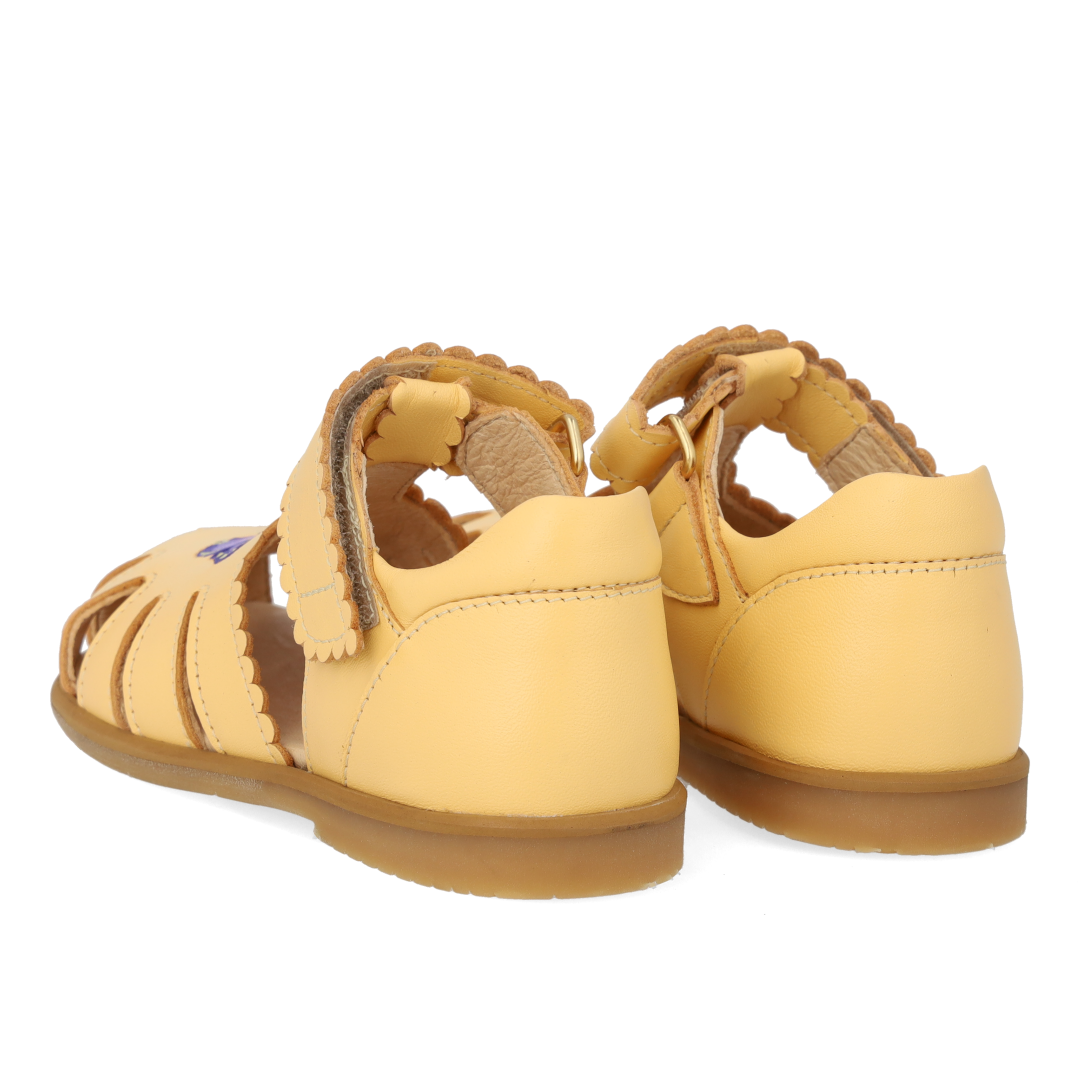 Sandal with closed toe and butterfly