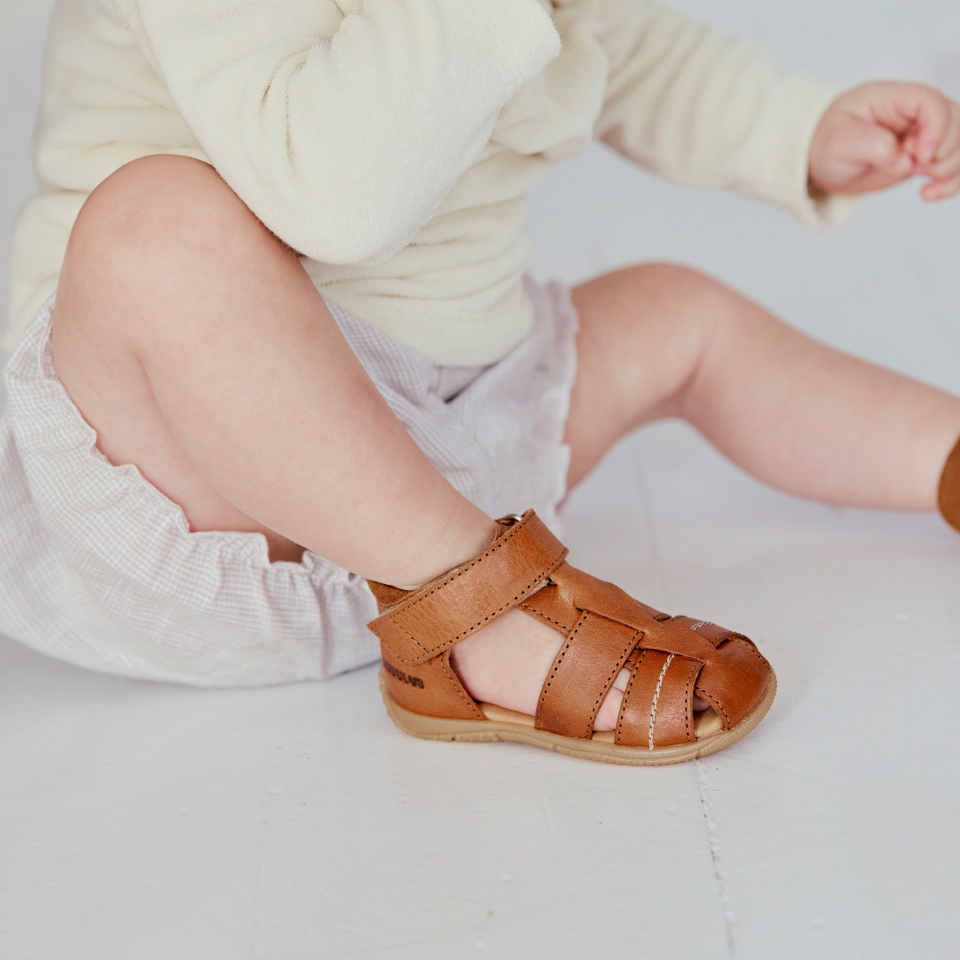 first steps sandal with cut-out heart pattern