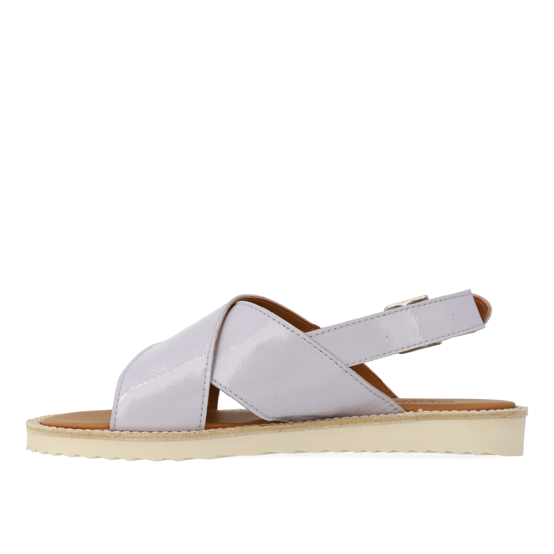 Cross-strap sandal with buckle fastening