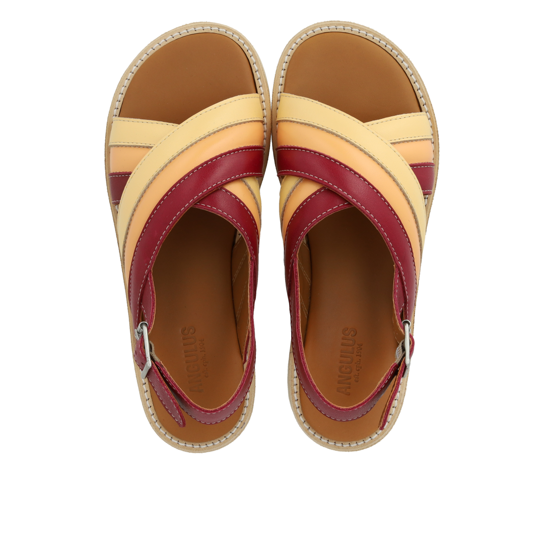 Padded cross-strap sandal with buckle closure
