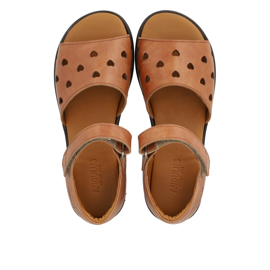 Leather sandal with cut-out heart pattern