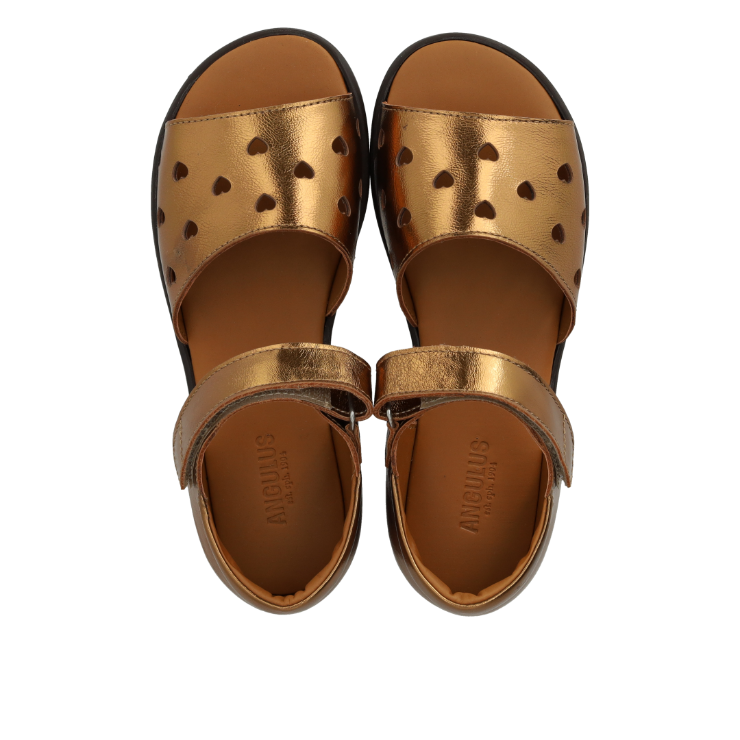Leather sandal with cut-out heart pattern
