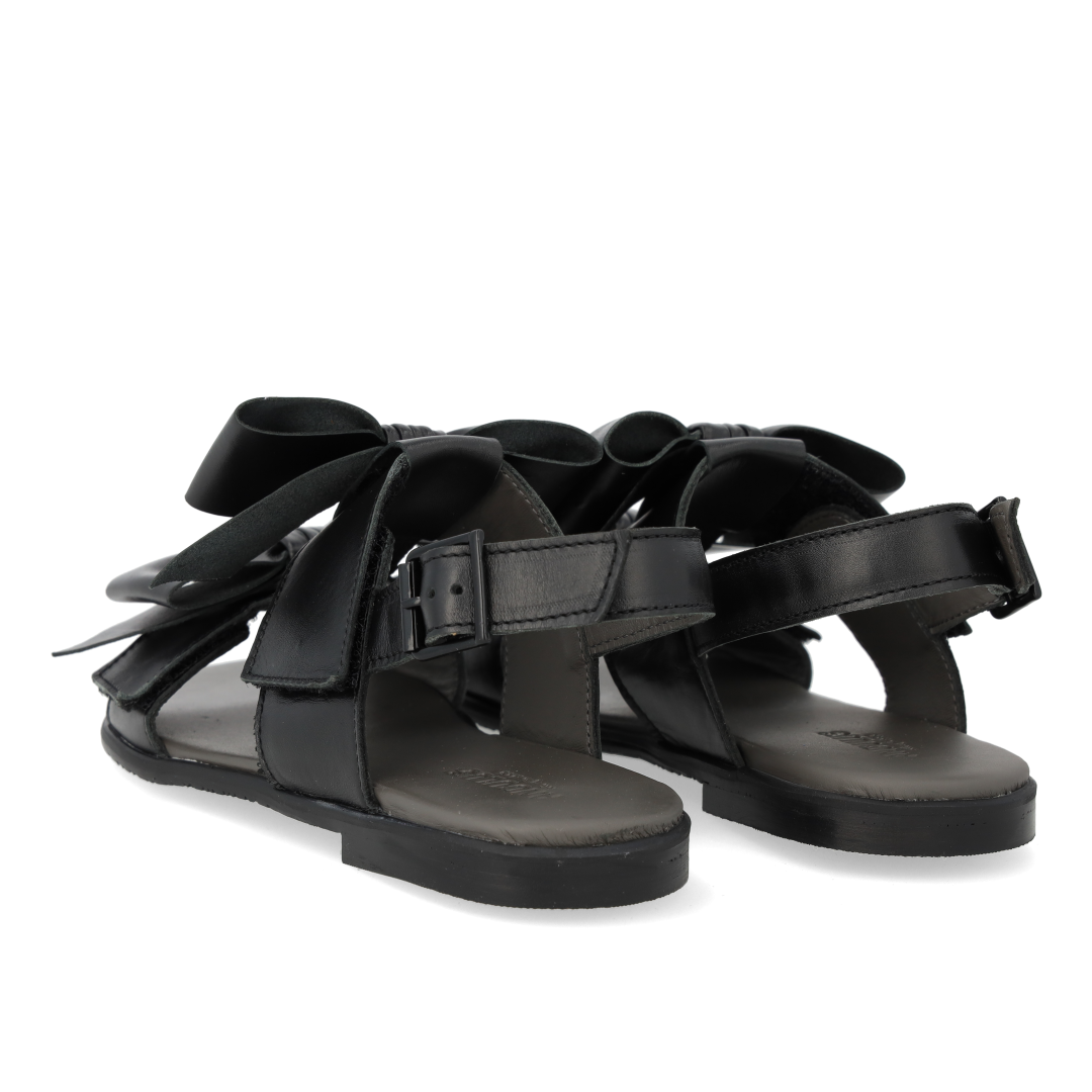 Sandal with bow, velcro and buckle