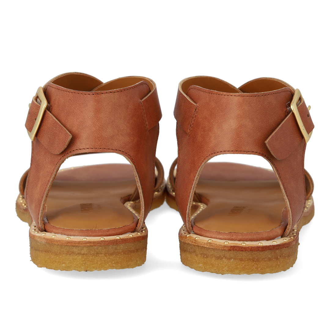 Sandal with crisscross straps and ankle buckle