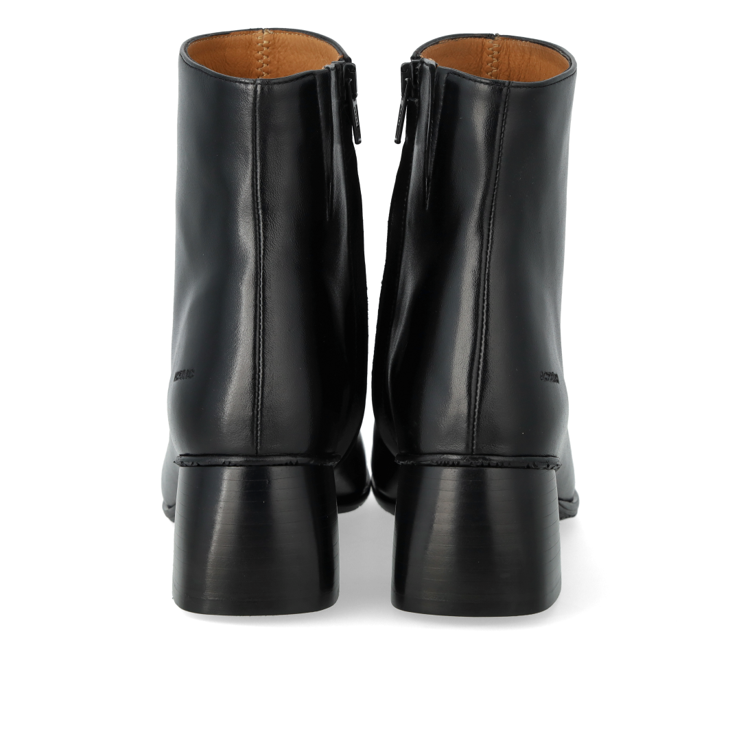 Boot with sculptural black wooden heel
