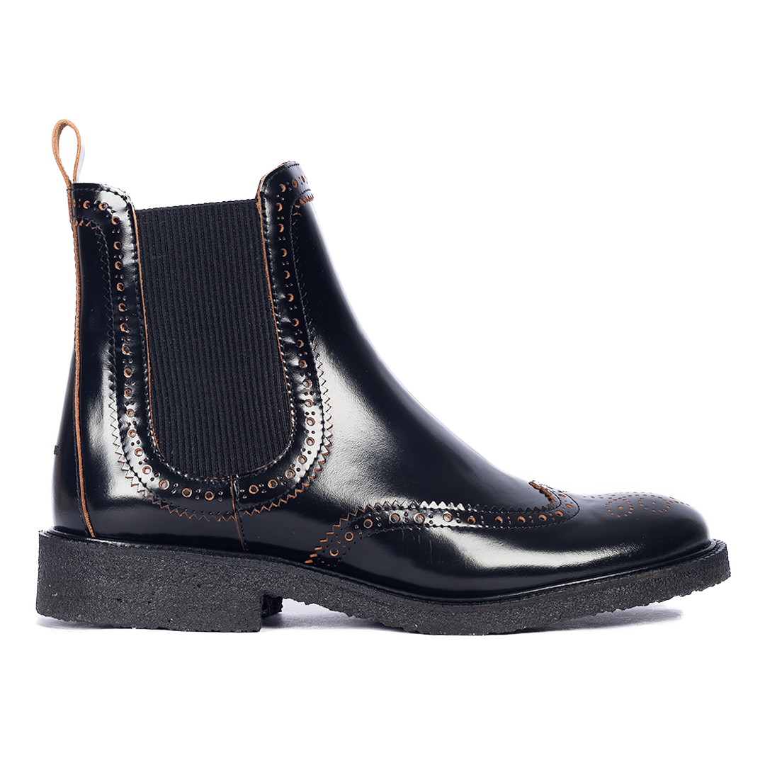 Boot with decorative brogue perforation pattern