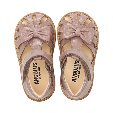 Starter sandal with a bow and velcro closure
