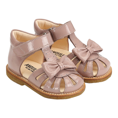 Starter sandal with a bow and velcro closure