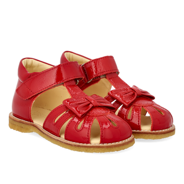Starter sandal with a bow and velcro closure