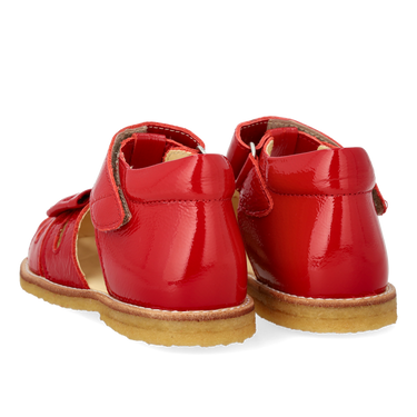 Starter sandal with a bow and velcro closure