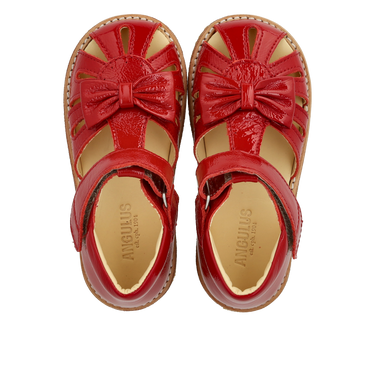 Starter sandal with a bow and velcro closure