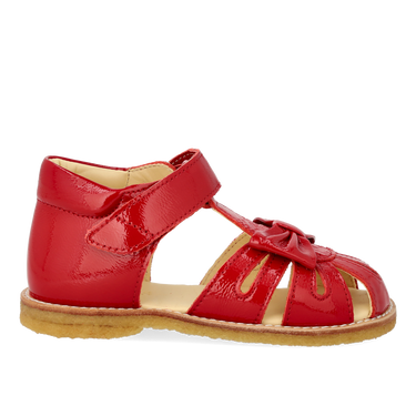 Starter sandal with a bow and velcro closure