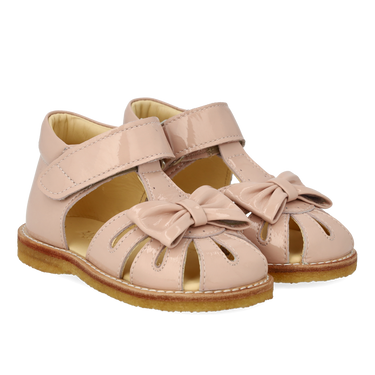 Starter sandal with a bow and velcro closure