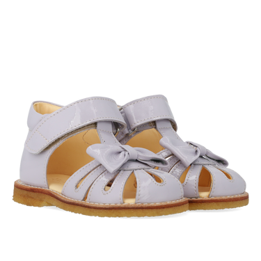 Starter sandal with a bow and velcro closure