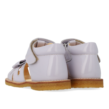 Starter sandal with a bow and velcro closure