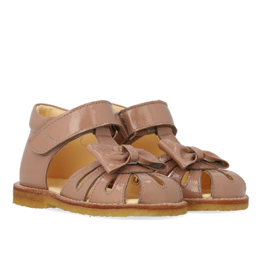 Starter sandal with a bow and velcro closure