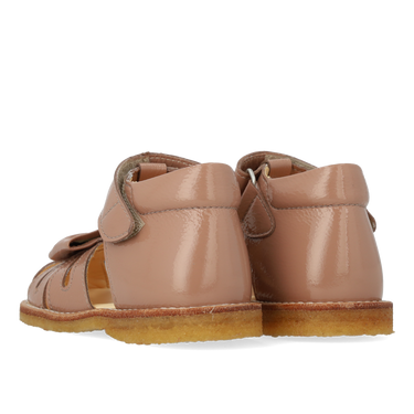 Starter sandal with a bow and velcro closure