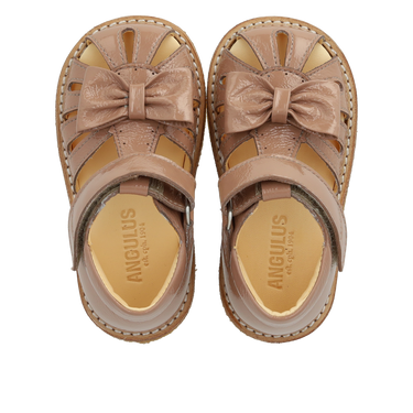 Starter sandal with a bow and velcro closure