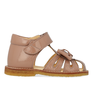 Starter sandal with a bow and velcro closure