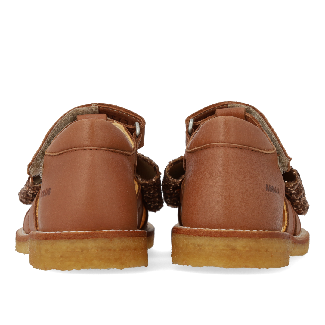Toddler sandal with glitter bow and Velcro closure