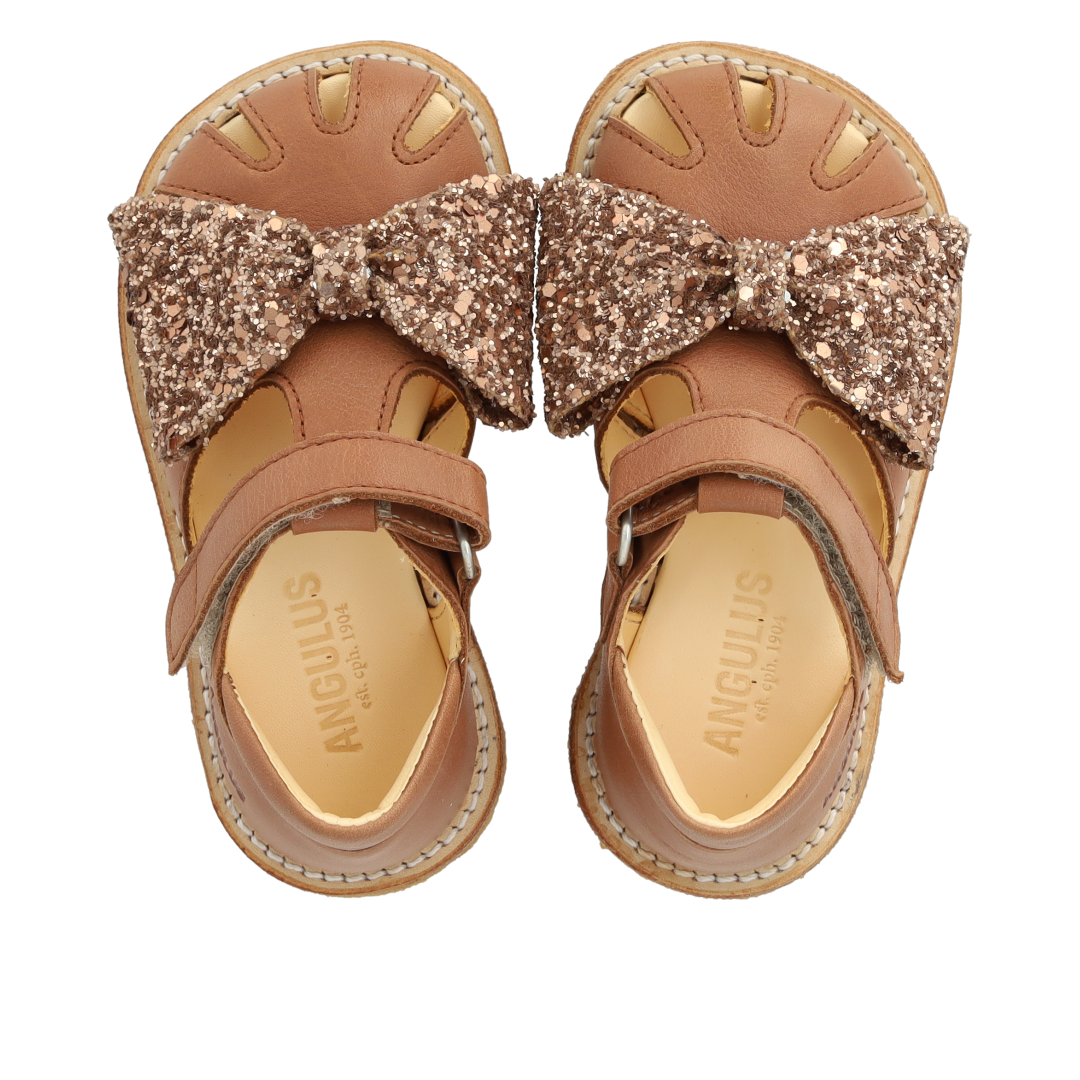 Toddler sandal with glitter bow and Velcro closure