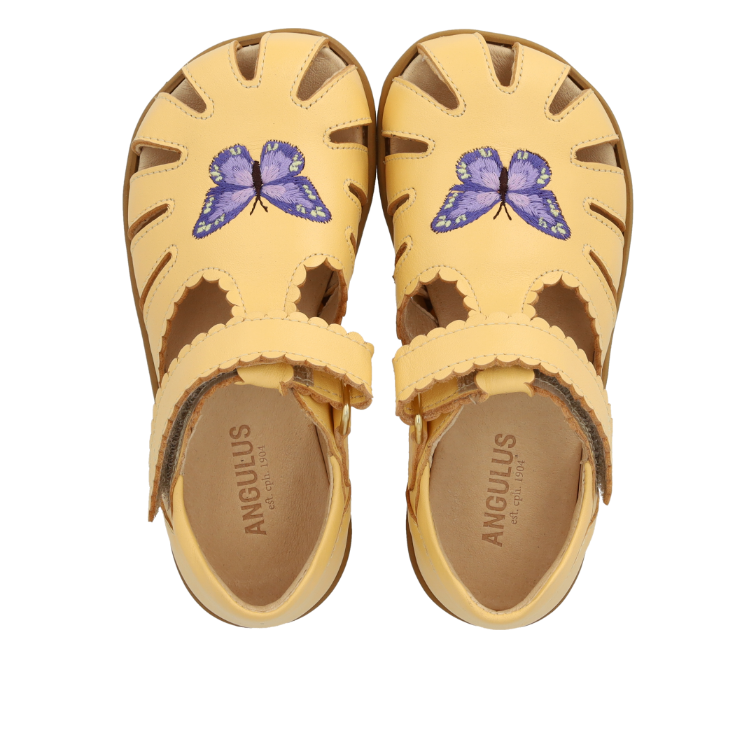 Sandal with closed toe and butterfly