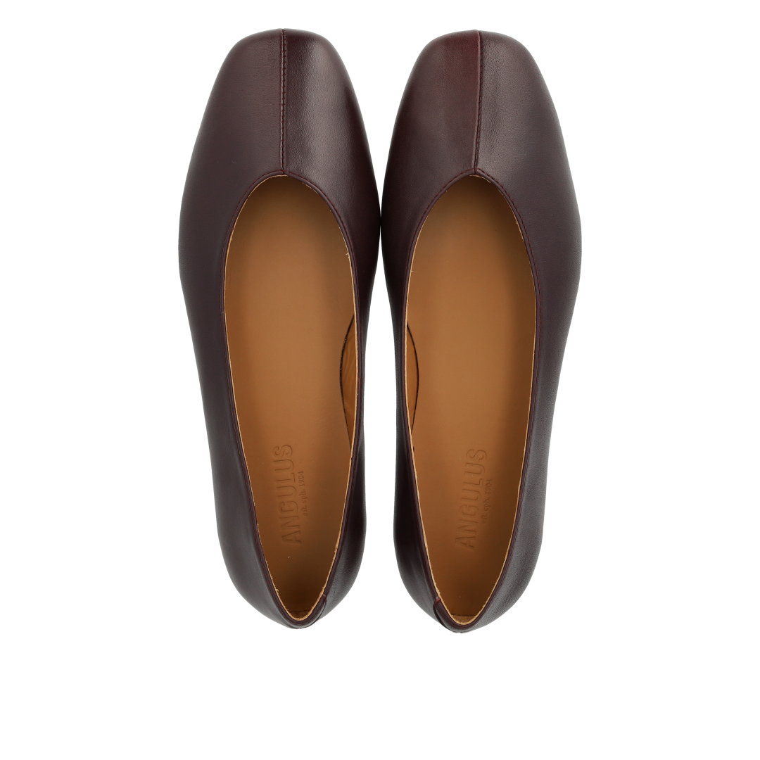 Ballerina with centered decorative stitching detail