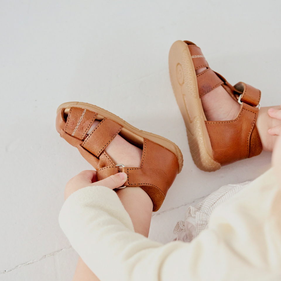 first steps sandal with cut-out heart pattern