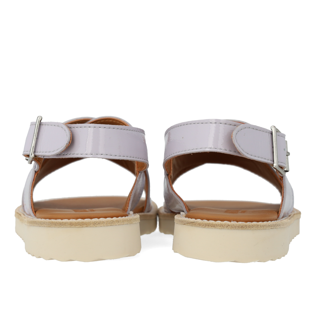 Cross-strap sandal with buckle fastening