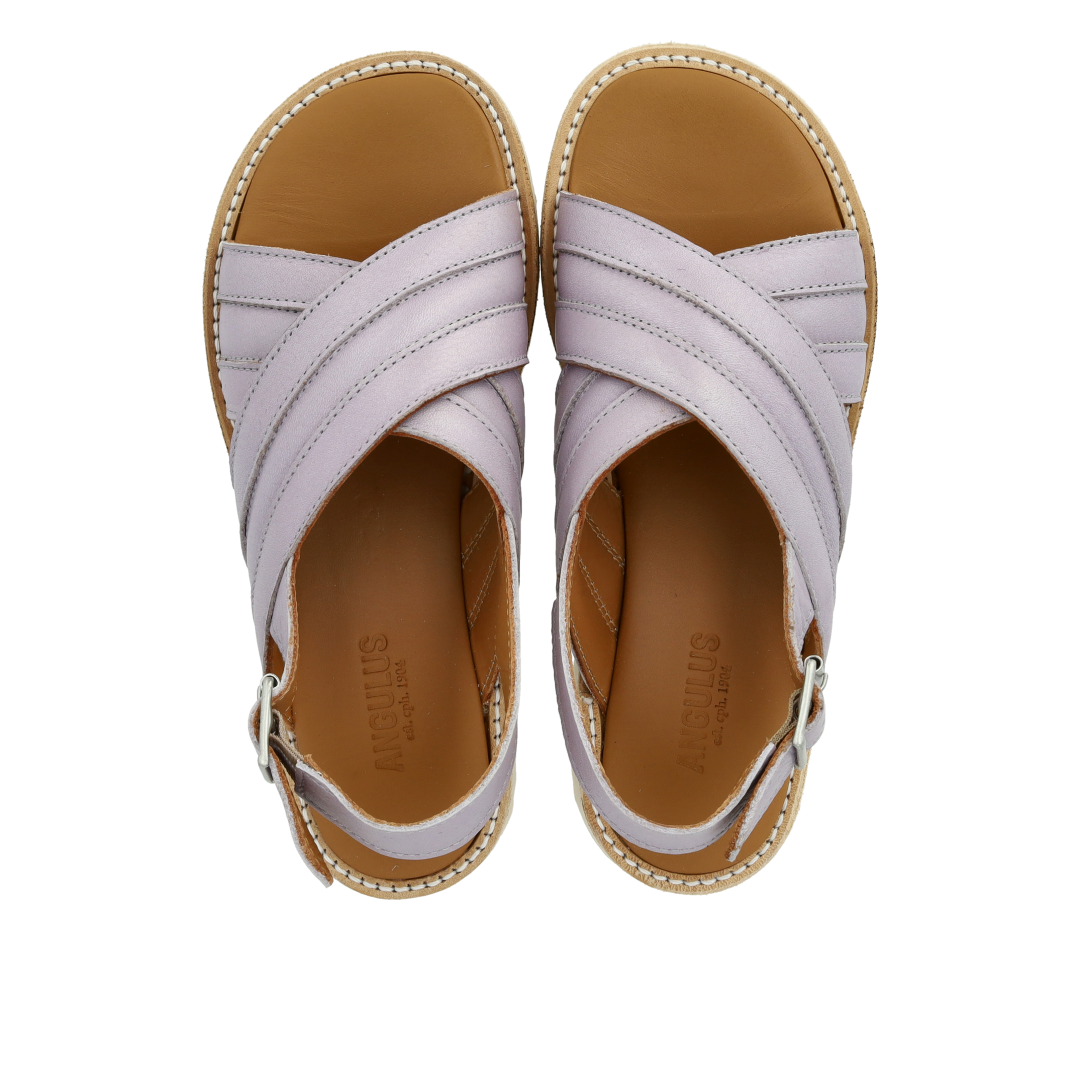 Padded cross sandal with buckle closure