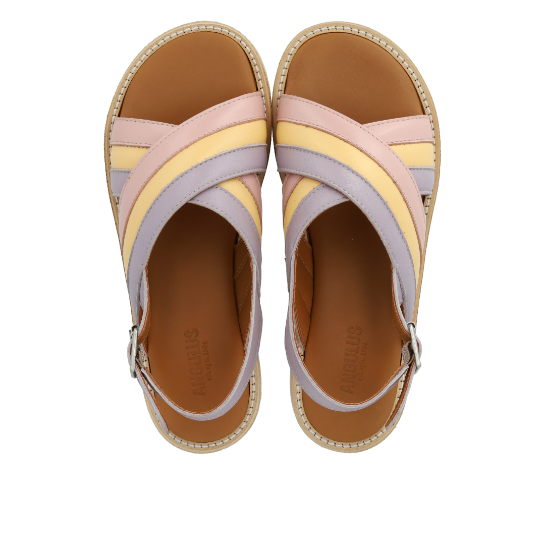 Padded cross sandal with buckle closure