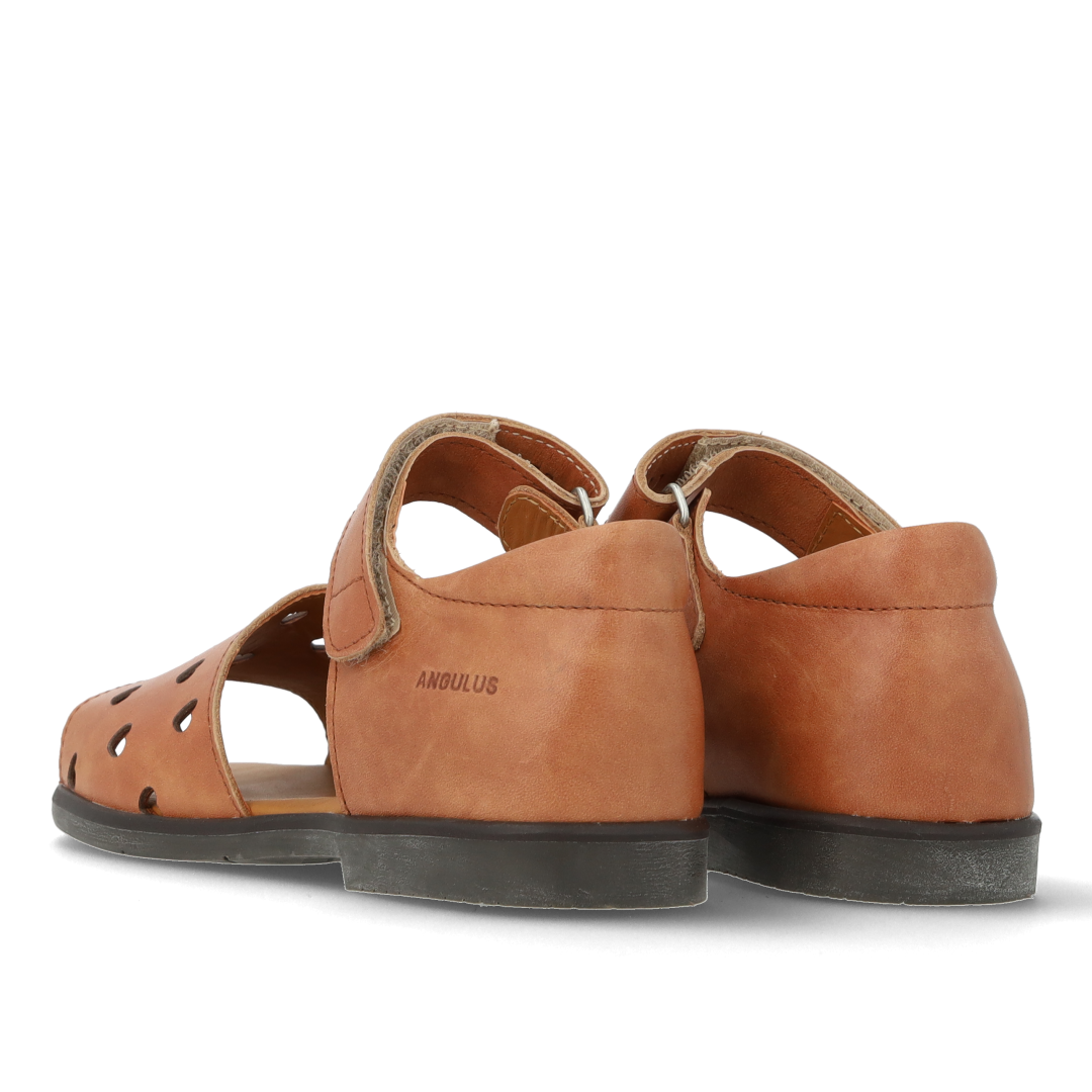 Leather sandal with cut-out heart pattern