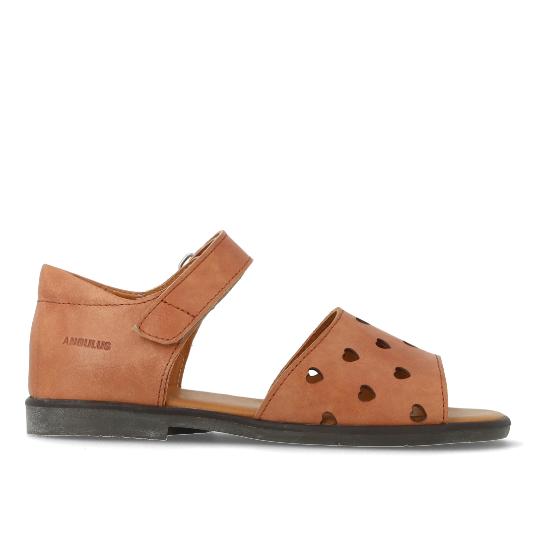 Leather sandal with cut-out heart pattern
