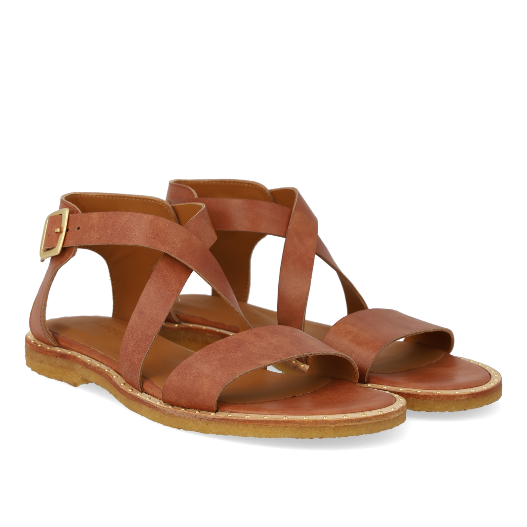 Sandal with crisscross straps and ankle buckle