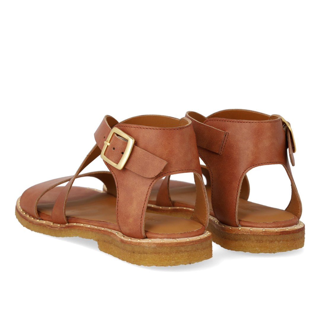 Sandal with crisscross straps and ankle buckle