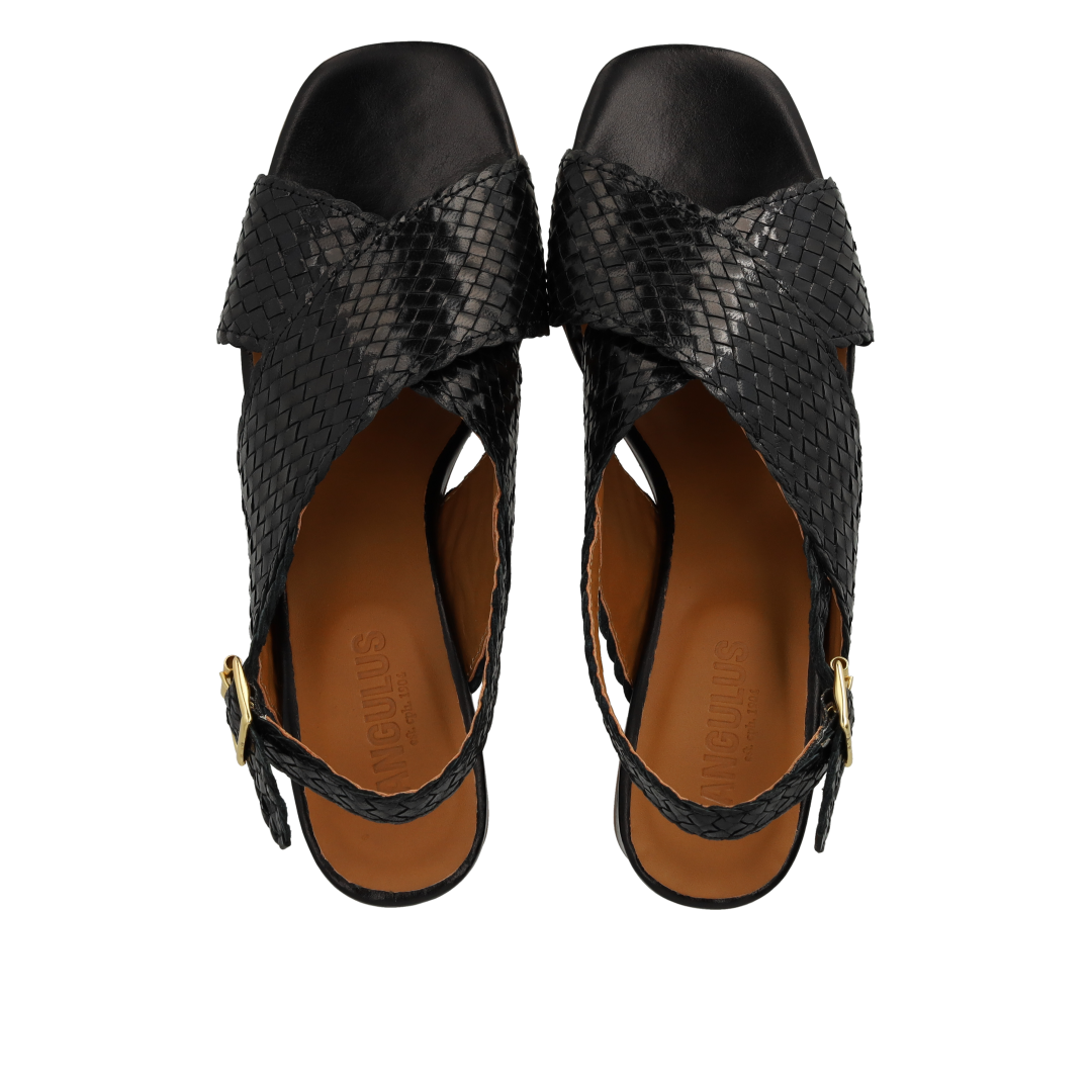High cross-strap sandal in hand-braided leather