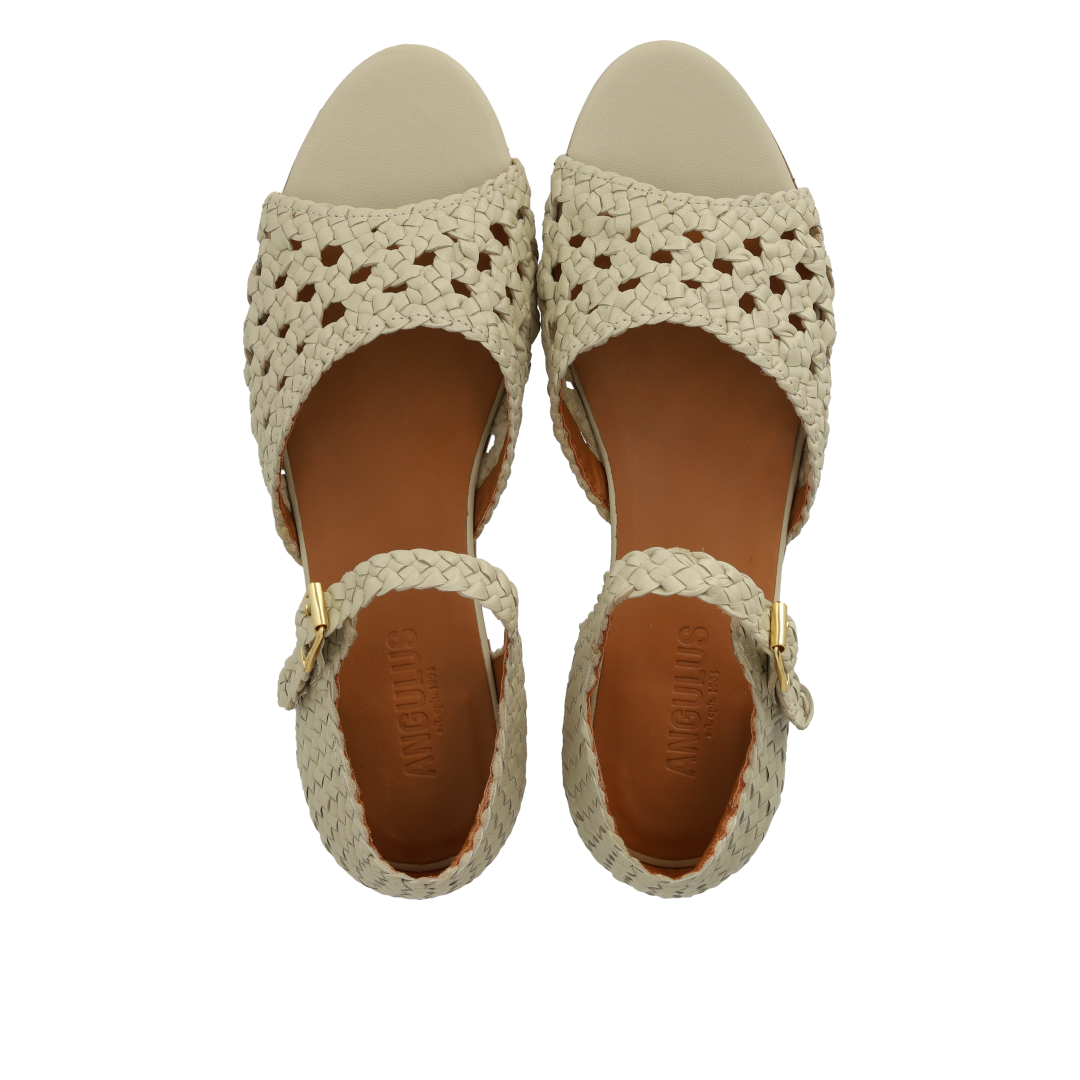 Hand-braided sandal with perforated pattern detail