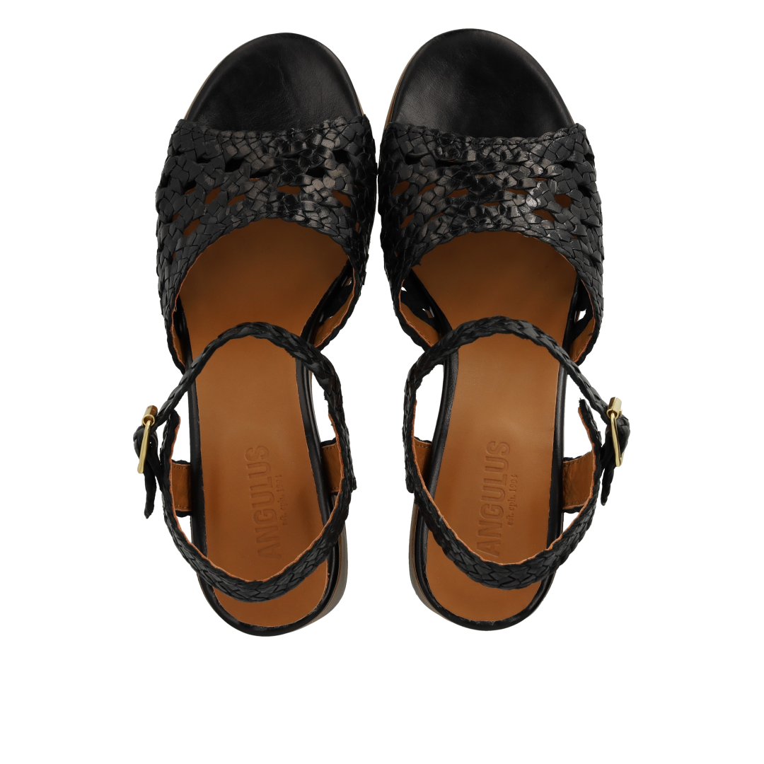 Hand-braided sandal with sculptural heel