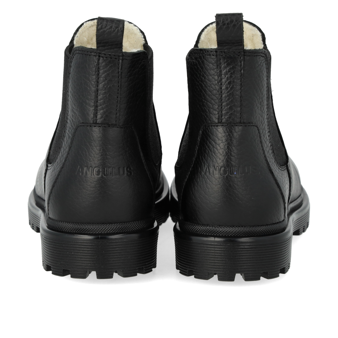 Boot with track sole and wool lining