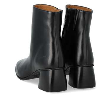 Boot with a sculptural black wooden heel