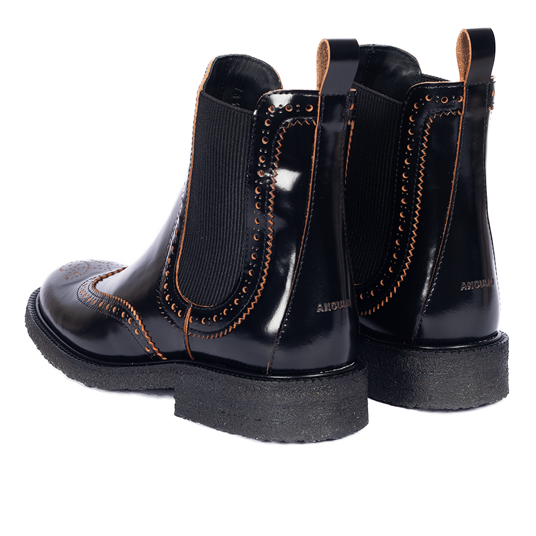 Boot with decorative brogue perforation pattern