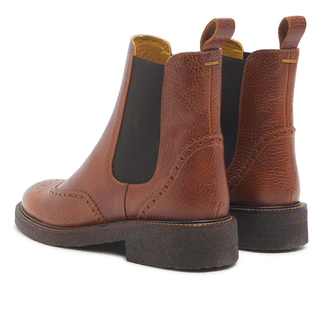 Boot with decorative brogue perforations