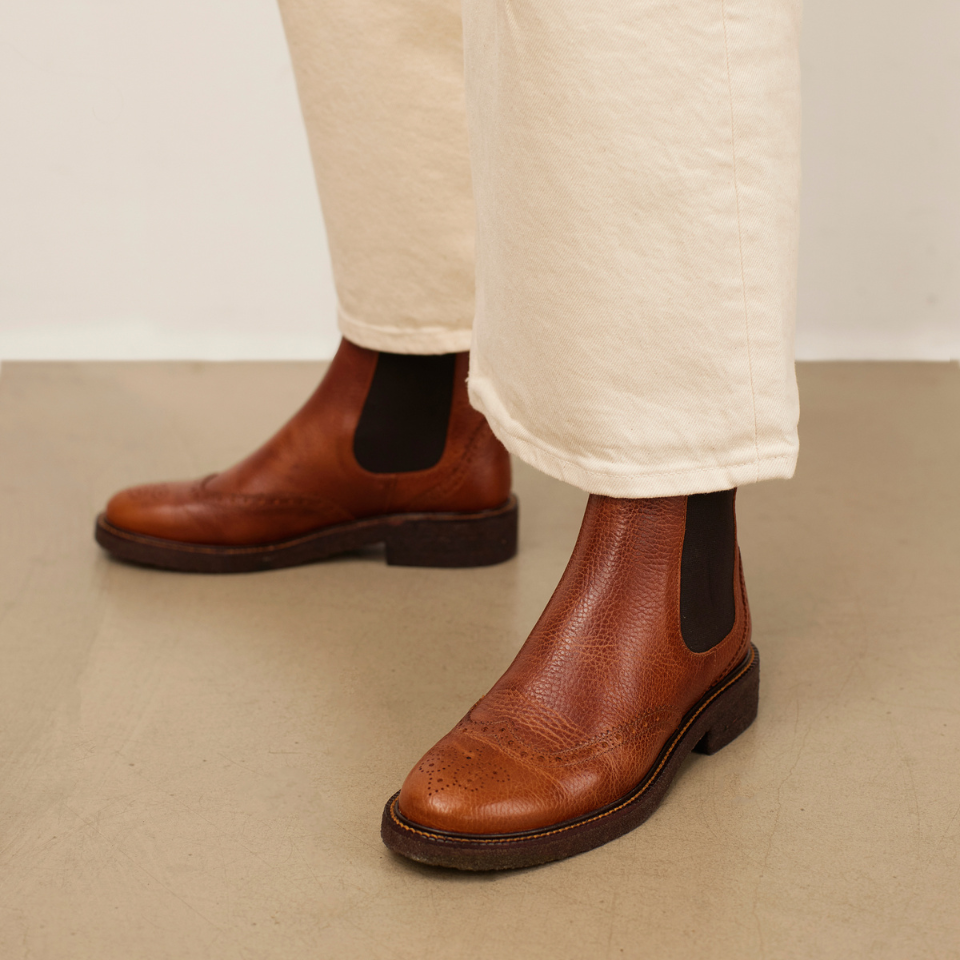 Boot with decorative brogue perforations