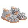 Angulus Starter sandal with a bow and velcro closure